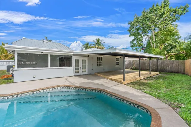 front view of a house with a backyard