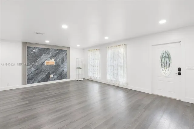 a kitchen with kitchen island a sink table and chairs