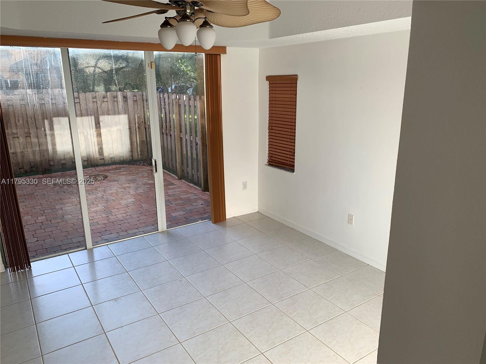3150 Southwest 152nd Place Miami, FL 33185 - Photo 15 of 47 a view of an empty room with a glass door