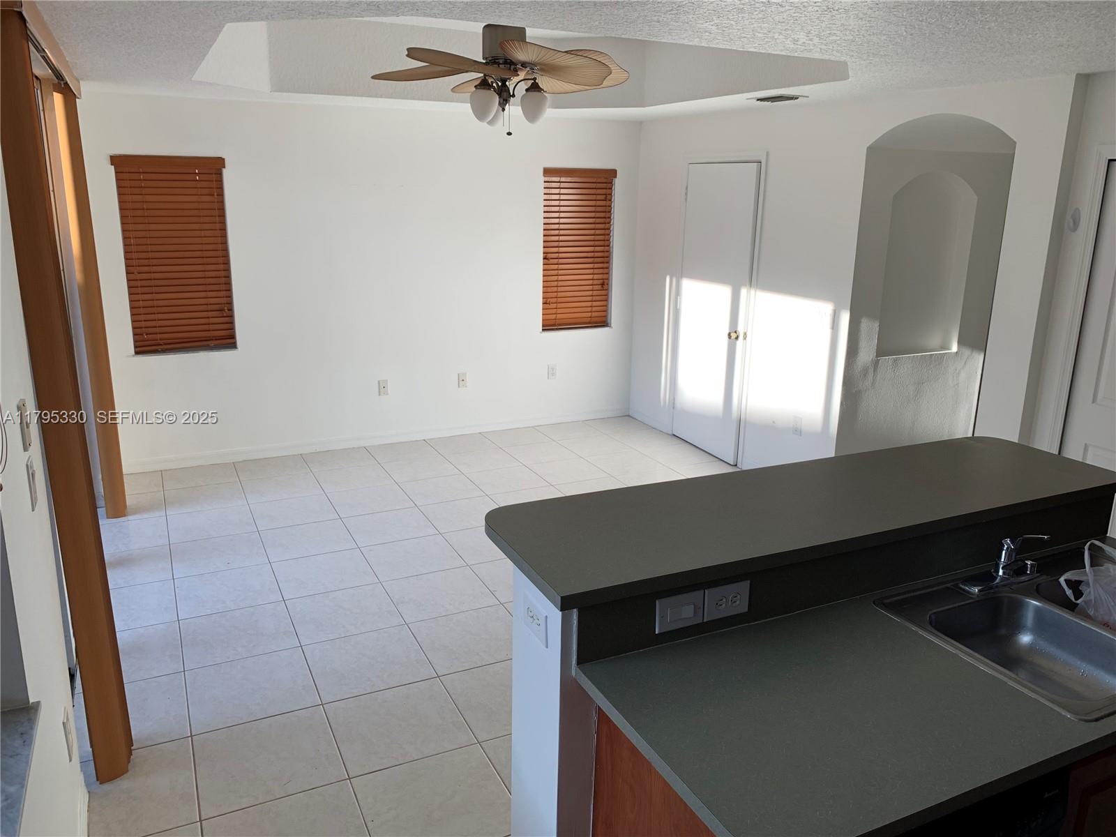 3150 Southwest 152nd Place Miami, FL 33185 - Photo 18 of 47 a view of a livingroom with furniture and window