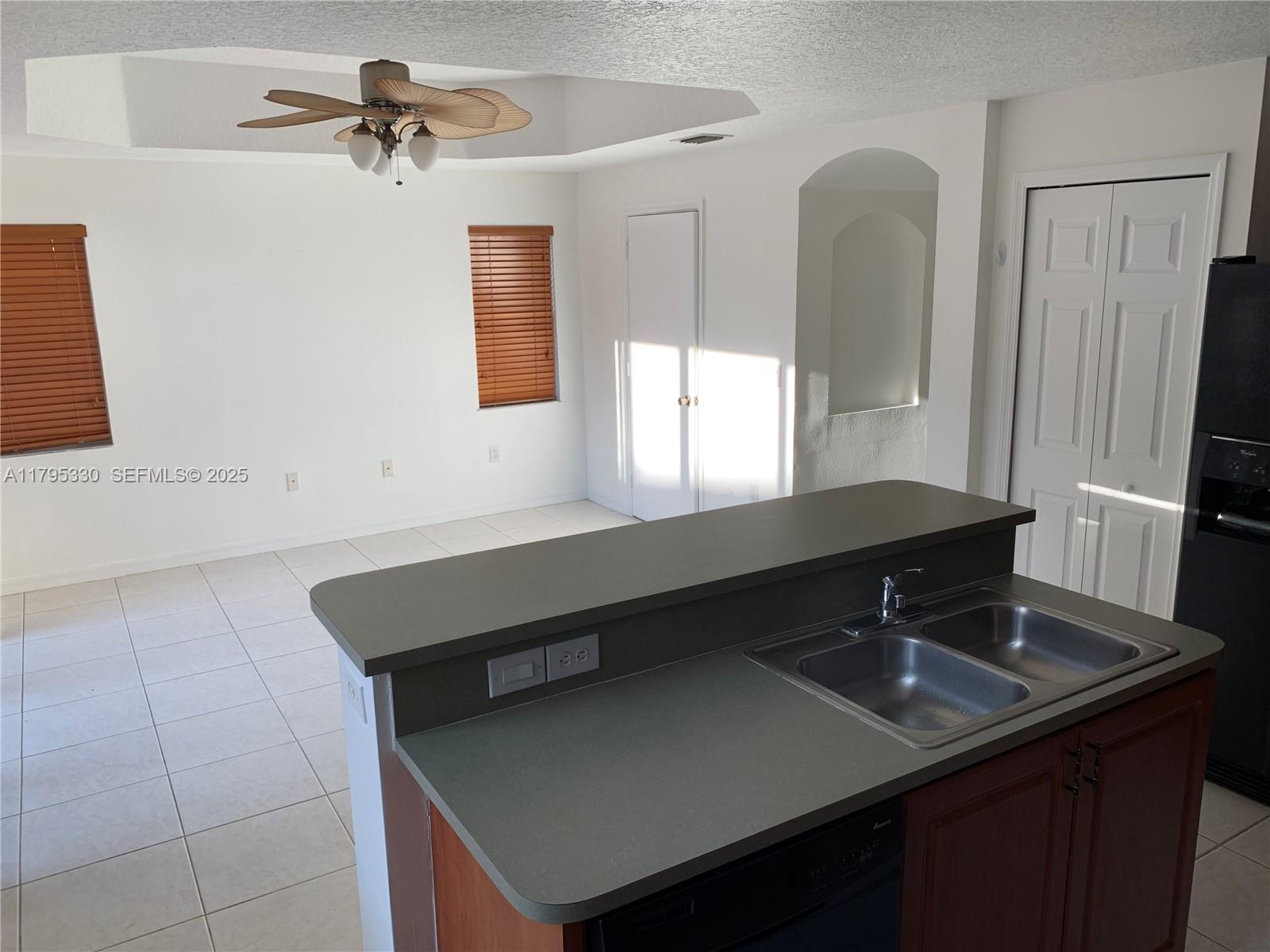 3150 Southwest 152nd Place Miami, FL 33185 - Photo 19 of 47 a bathroom with a sink and a mirror