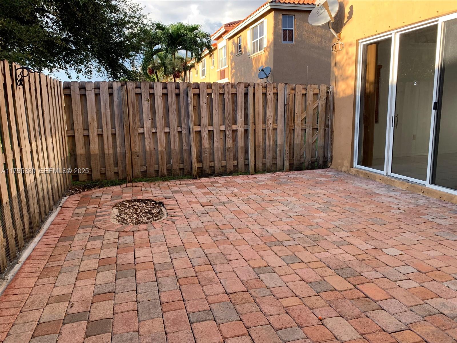 3150 Southwest 152nd Place Miami, FL 33185 - Photo 23 of 47 a view of backyard with wooden fence