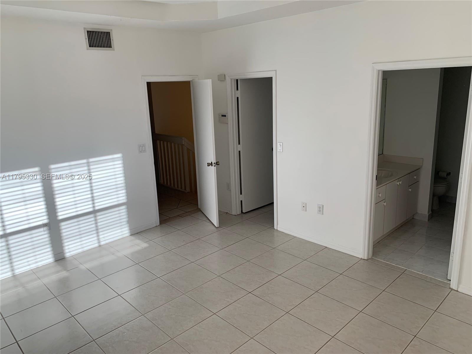 3150 Southwest 152nd Place Miami, FL 33185 - Photo 28 of 47 an empty room with windows
