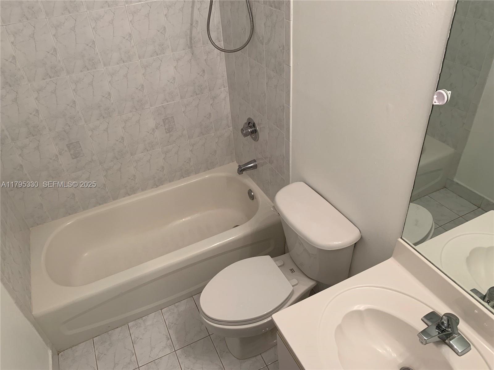 3150 Southwest 152nd Place Miami, FL 33185 - Photo 37 of 47 a bathroom with a toilet and a sink