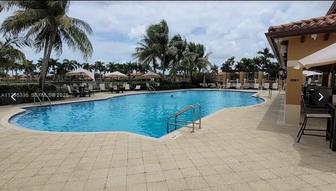 3150 Southwest 152nd Place Miami, FL 33185 - Photo 44 of 47 a view of a swimming pool and lounge chair