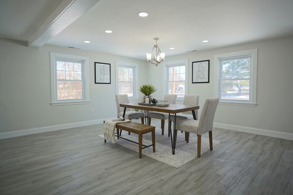 28 Chamberlain Road Chelmsford, MA 01824 - Photo 15 of 38 a view of a dining room with furniture and wooden floor