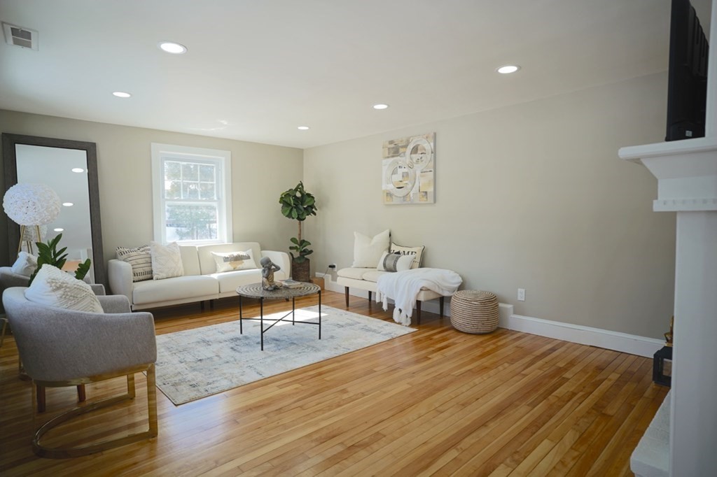 28 Chamberlain Road Chelmsford, MA 01824 - Photo 17 of 38 a living room with furniture and a potted plant