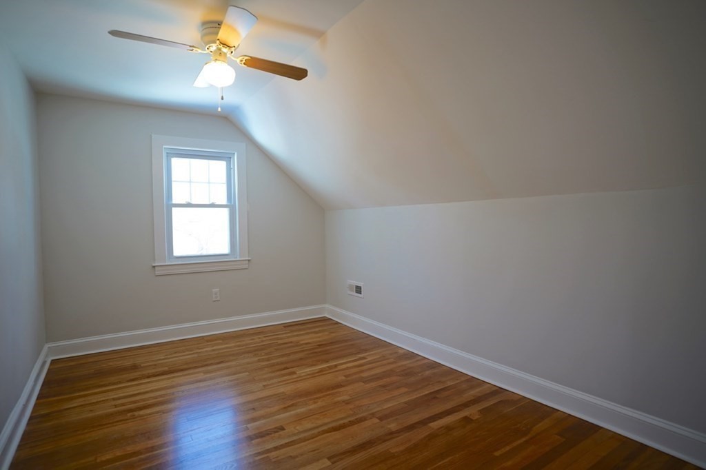 28 Chamberlain Road Chelmsford, MA 01824 - Photo 28 of 38 wooden floor in an empty room with a window