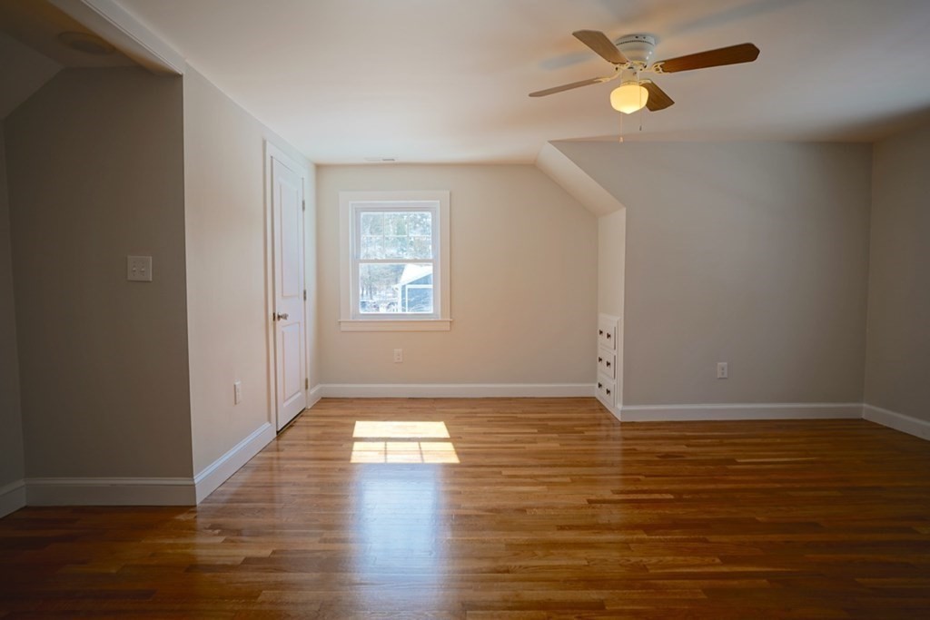 28 Chamberlain Road Chelmsford, MA 01824 - Photo 30 of 38 a view of empty room with wooden floor and fan