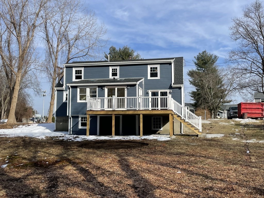 28 Chamberlain Road Chelmsford, MA 01824 - Photo 3 of 38 a front view of a house with a yard