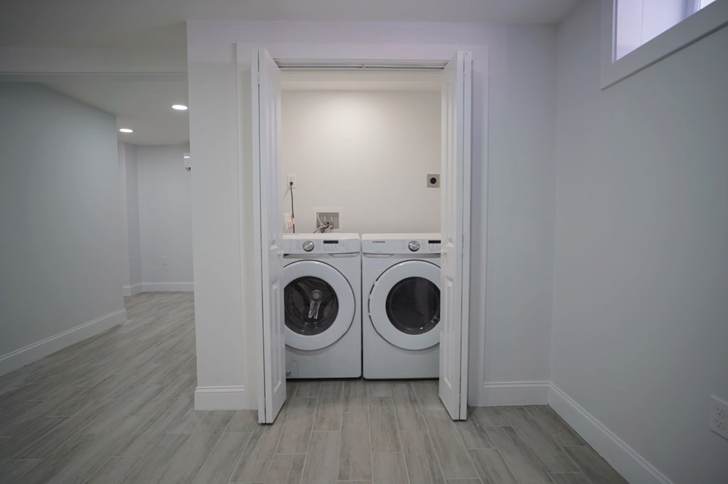 28 Chamberlain Road Chelmsford, MA 01824 - Photo 32 of 38 a view of a storage and utility room with washer and dryer