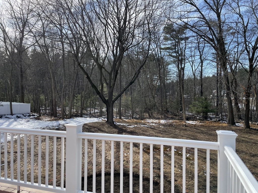 28 Chamberlain Road Chelmsford, MA 01824 - Photo 4 of 38 a view of street with wooden fence