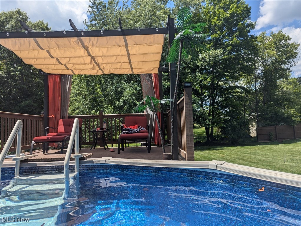 240 Spring Creek Road Northfield, OH 44067 - Photo 31 of 39 View of swimming pool featuring a pergola and a lawn