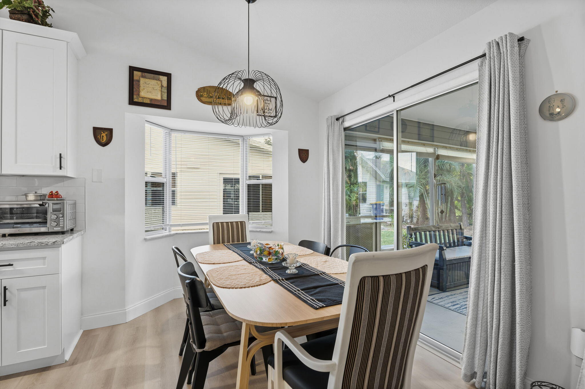 3822 Southeast Canvasback Place Stuart, FL 34997 - Photo 17 of 38 a view of a dining room with furniture window and outside view