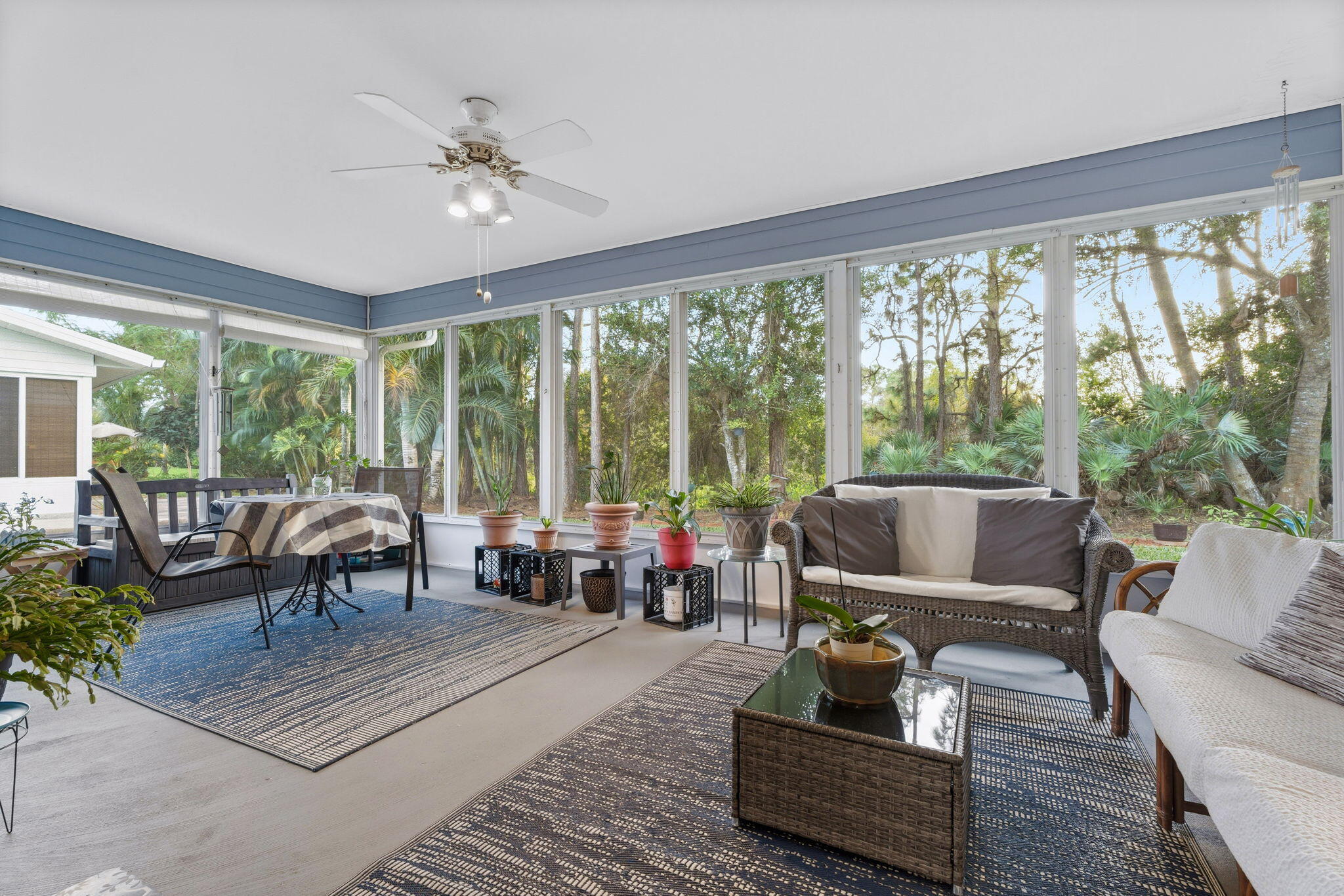 3822 Southeast Canvasback Place Stuart, FL 34997 - Photo 19 of 38 a living room with furniture and large windows