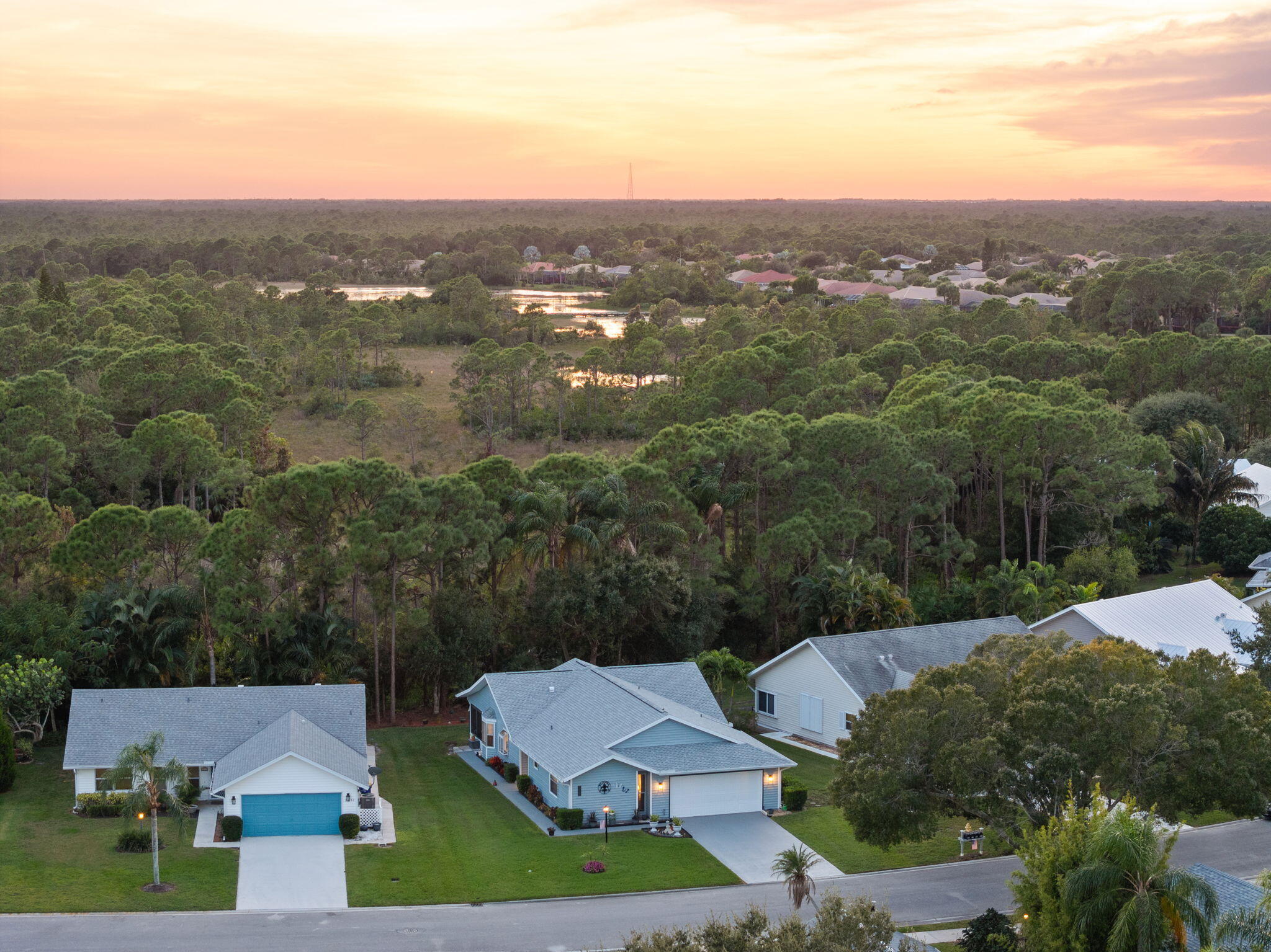 3822 Southeast Canvasback Place Stuart, FL 34997 - Photo 2 of 38 an aerial view of residential houses with outdoor space and trees
