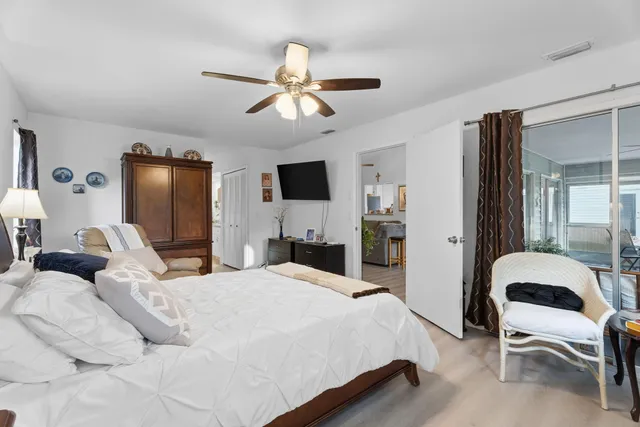 a bedroom with a bed couch and window