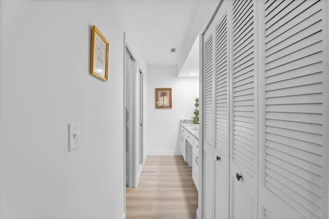 a bathroom with a granite countertop sink and mirror