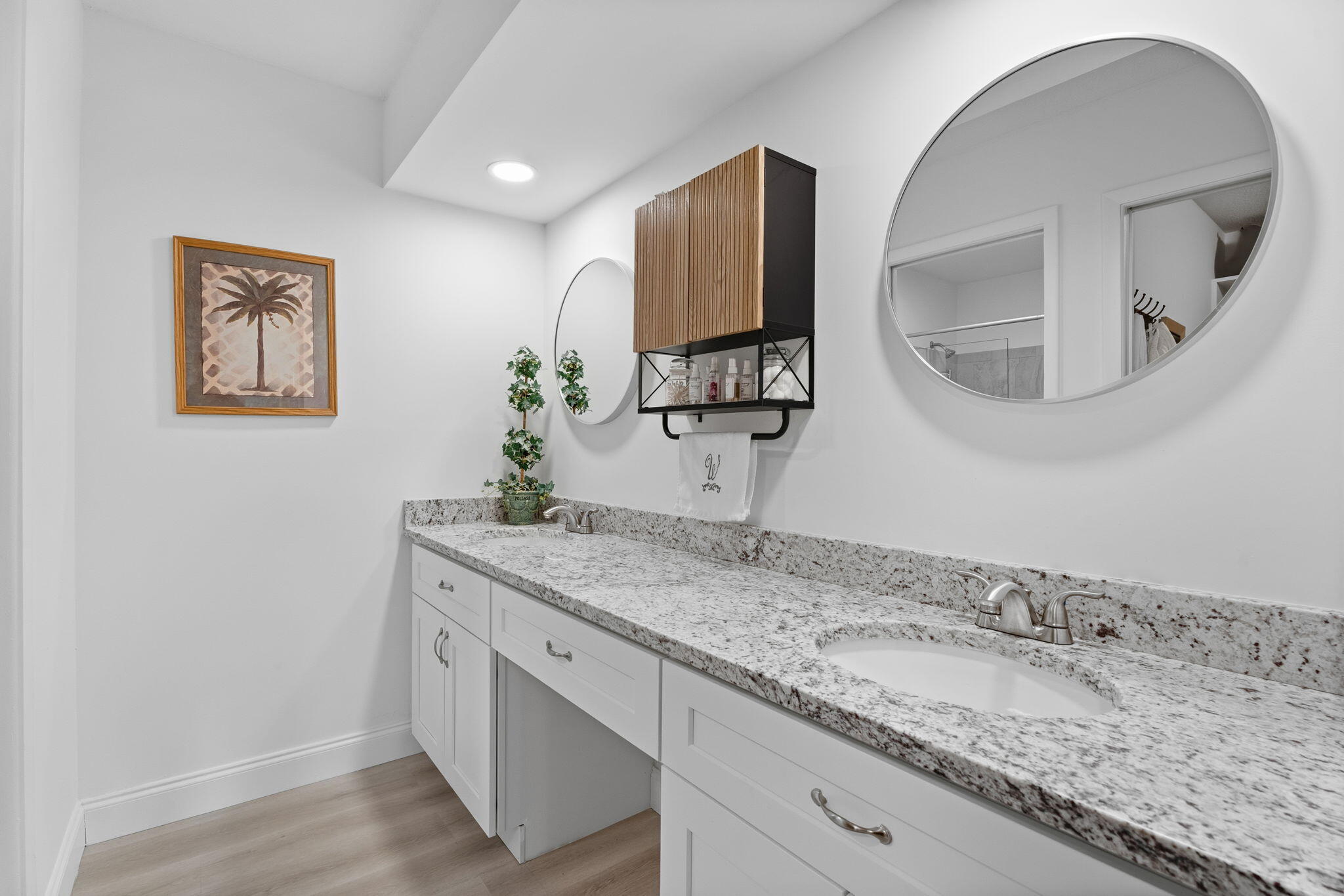 3822 Southeast Canvasback Place Stuart, FL 34997 - Photo 24 of 38 a bathroom with a granite countertop sink and mirror