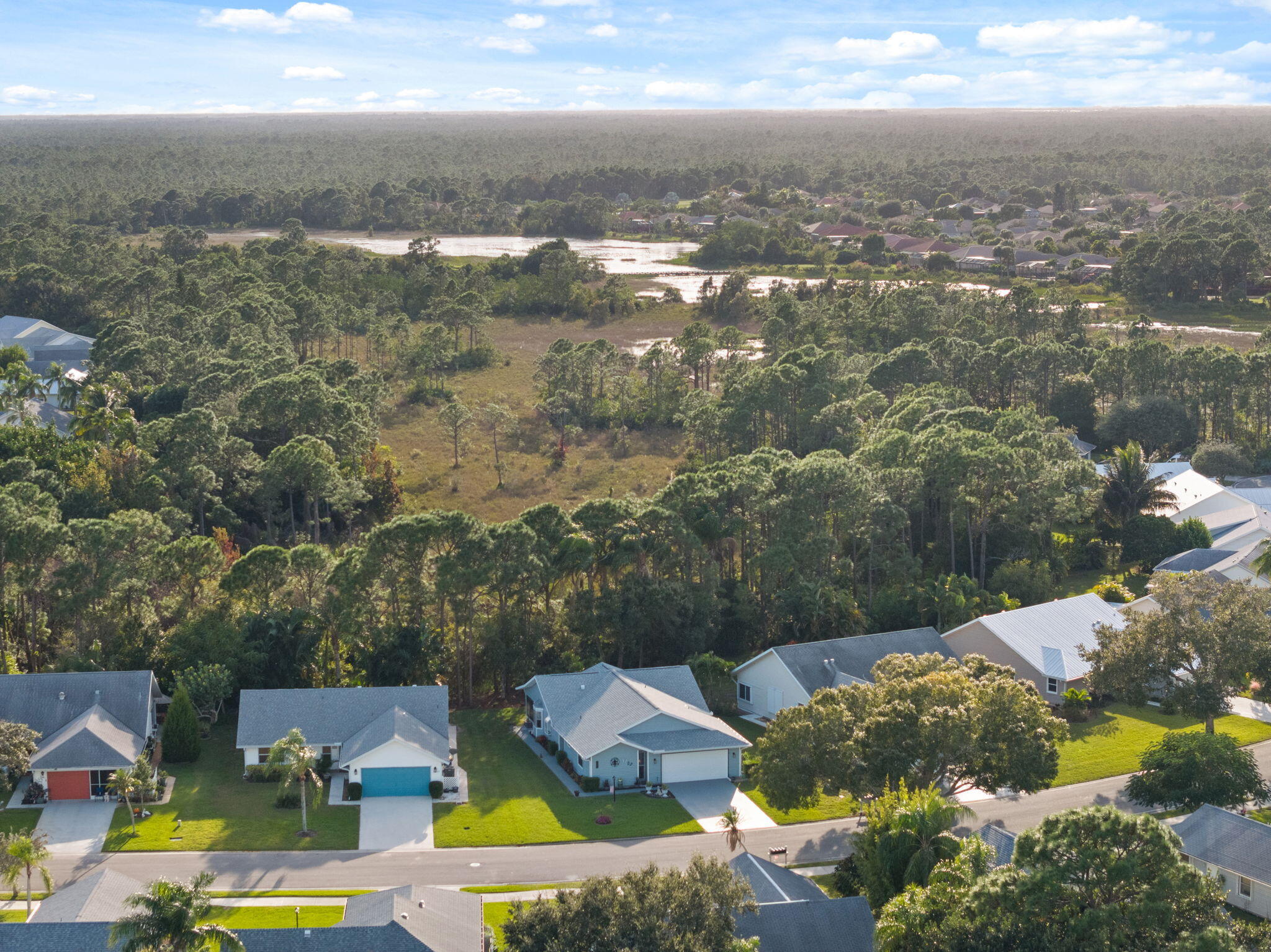 3822 Southeast Canvasback Place Stuart, FL 34997 - Photo 28 of 38 an aerial view of residential houses with outdoor space