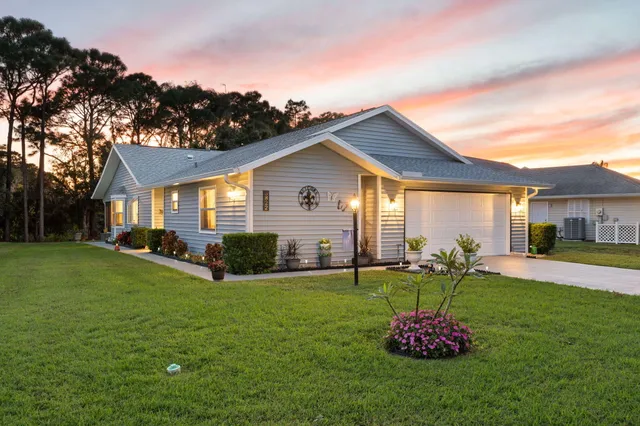 an aerial view of a house with a mountain view