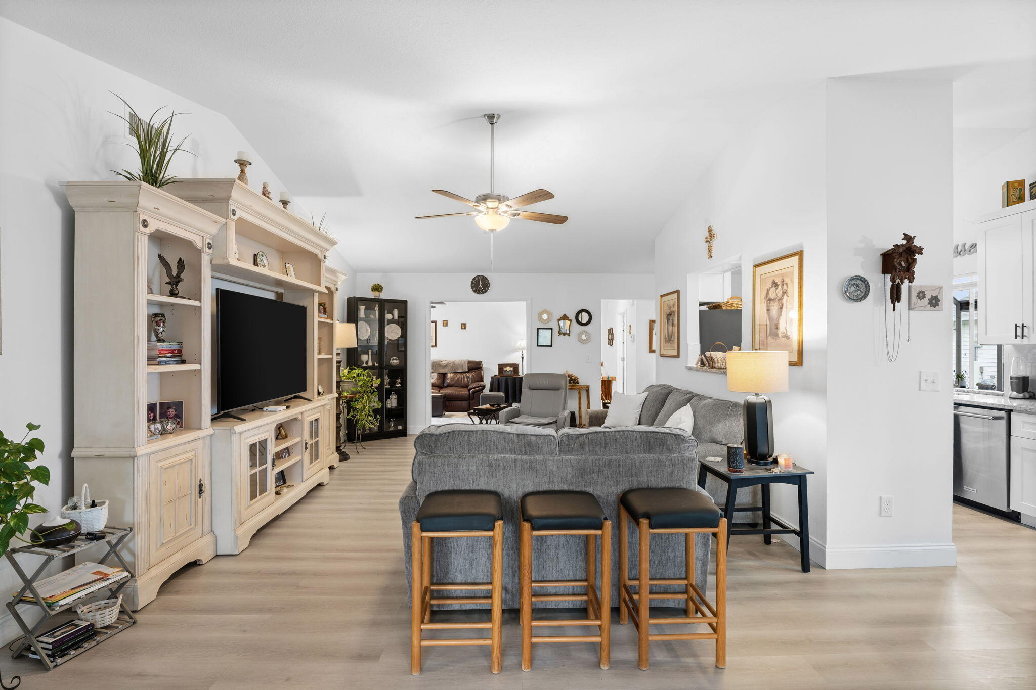 3822 Southeast Canvasback Place Stuart, FL 34997 - Photo 6 of 38 a view of a dining room with furniture wooden floor and chandelier