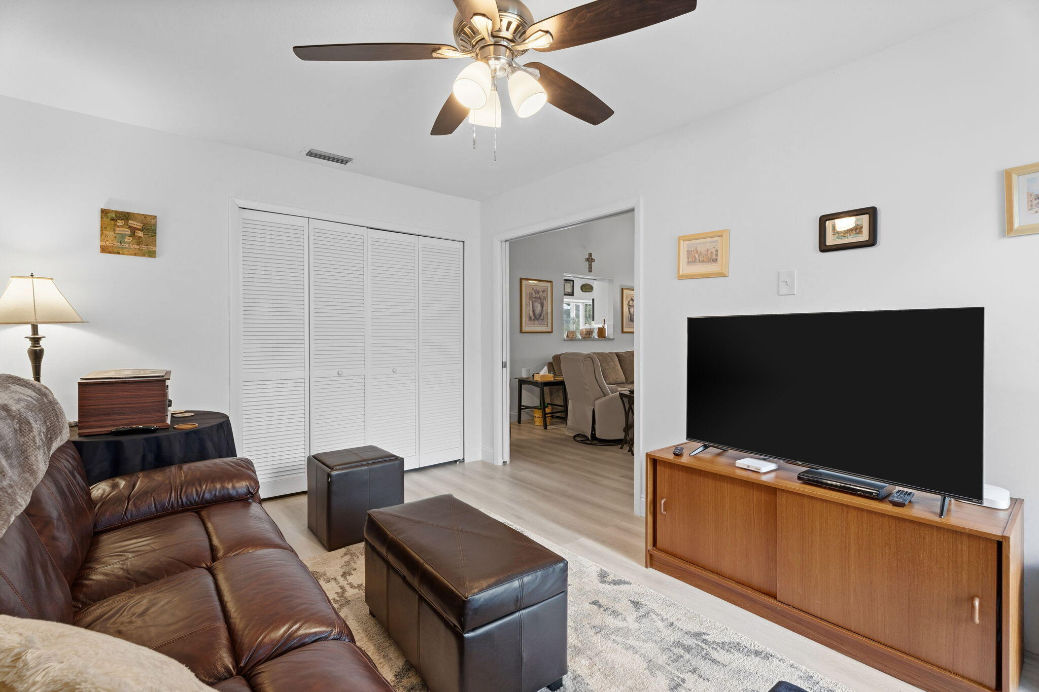 3822 Southeast Canvasback Place Stuart, FL 34997 - Photo 9 of 38 a living room with furniture and a flat screen tv
