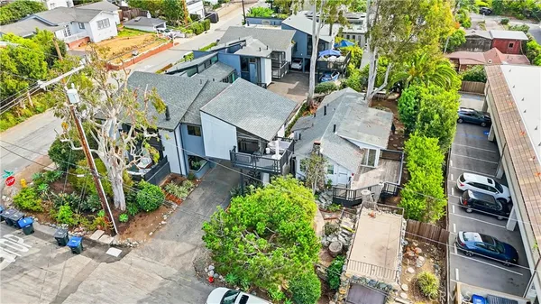 an aerial view of a house with a yard and garden