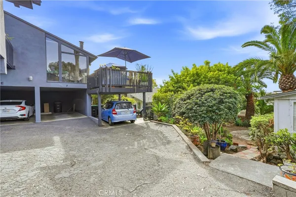 a view of a car is parked in front of a building