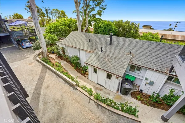 an aerial view of a house with outdoor space