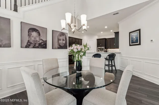 a kitchen with kitchen island stainless steel appliances a sink stove and refrigerator