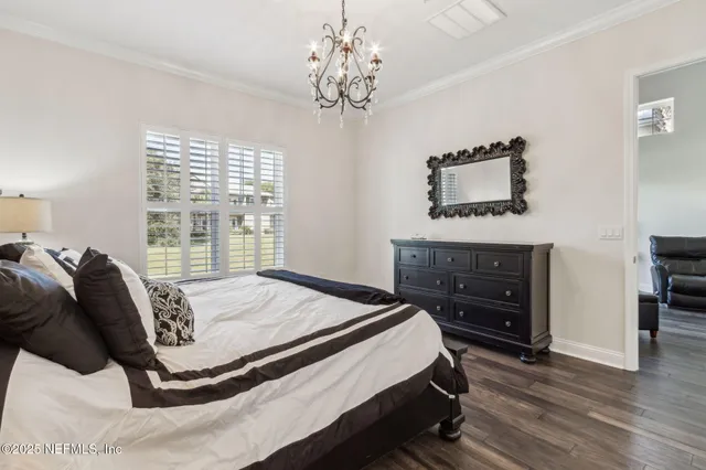 a bathroom with a granite countertop bathtub sink double and mirror