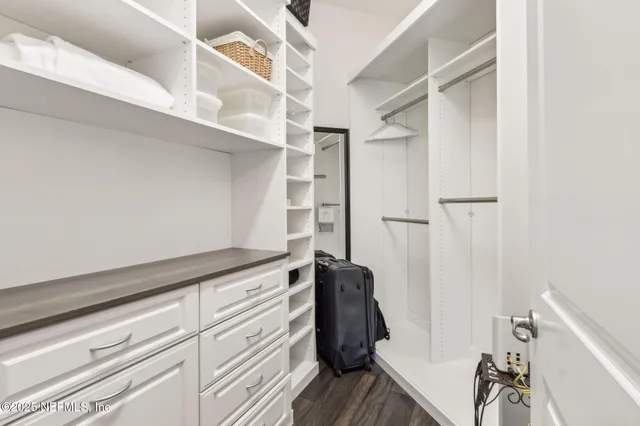 a view of a balcony with lake view and wooden floor