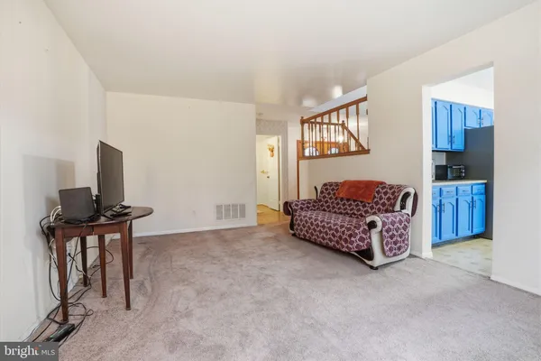 a bedroom with a bed and a television