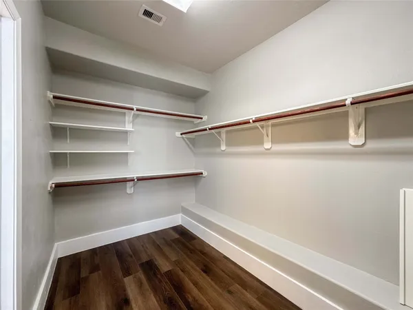 a view of an empty walk in closet