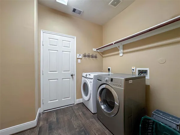 a view of storage and utility room with washer and dryer