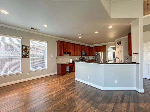 a view of kitchen with wooden floor