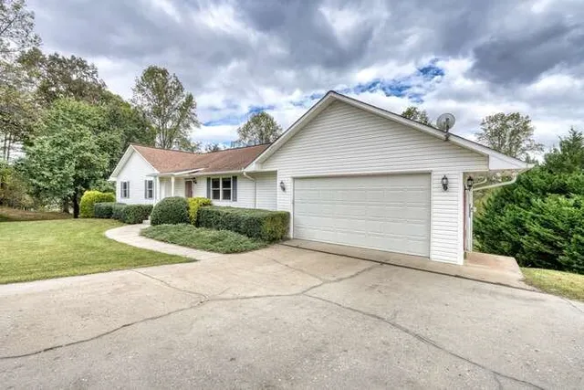 a view of house with outdoor space and street view