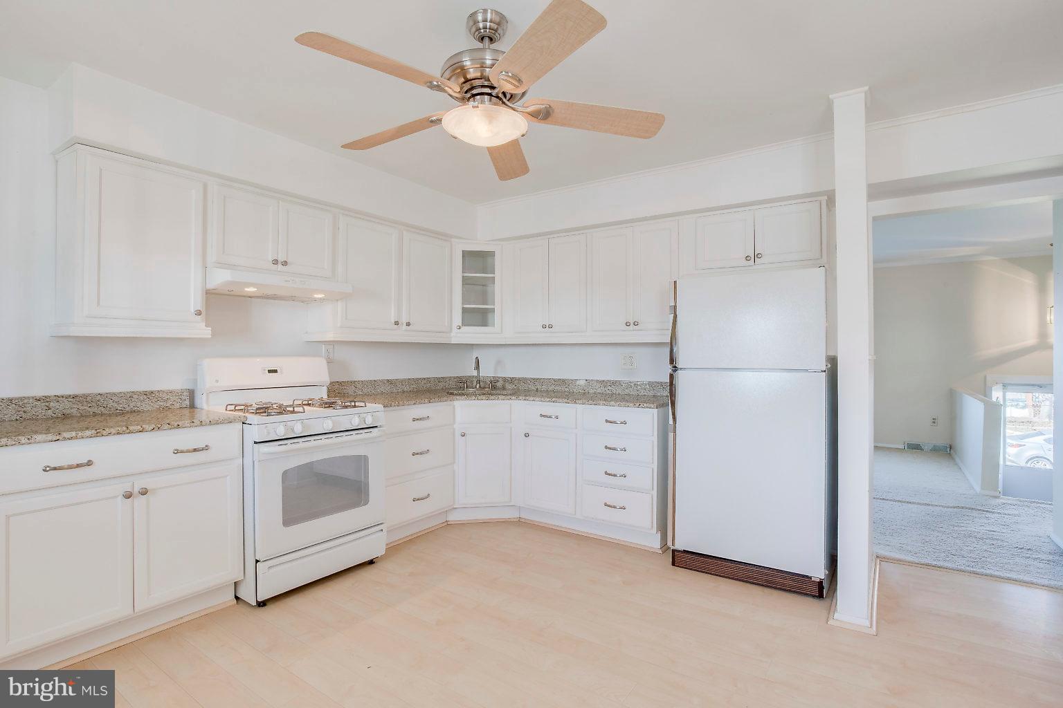 2011 Shore Road Dundalk, MD 21222 - Photo 24 of 37 a kitchen with cabinets stainless steel appliances and a counter space