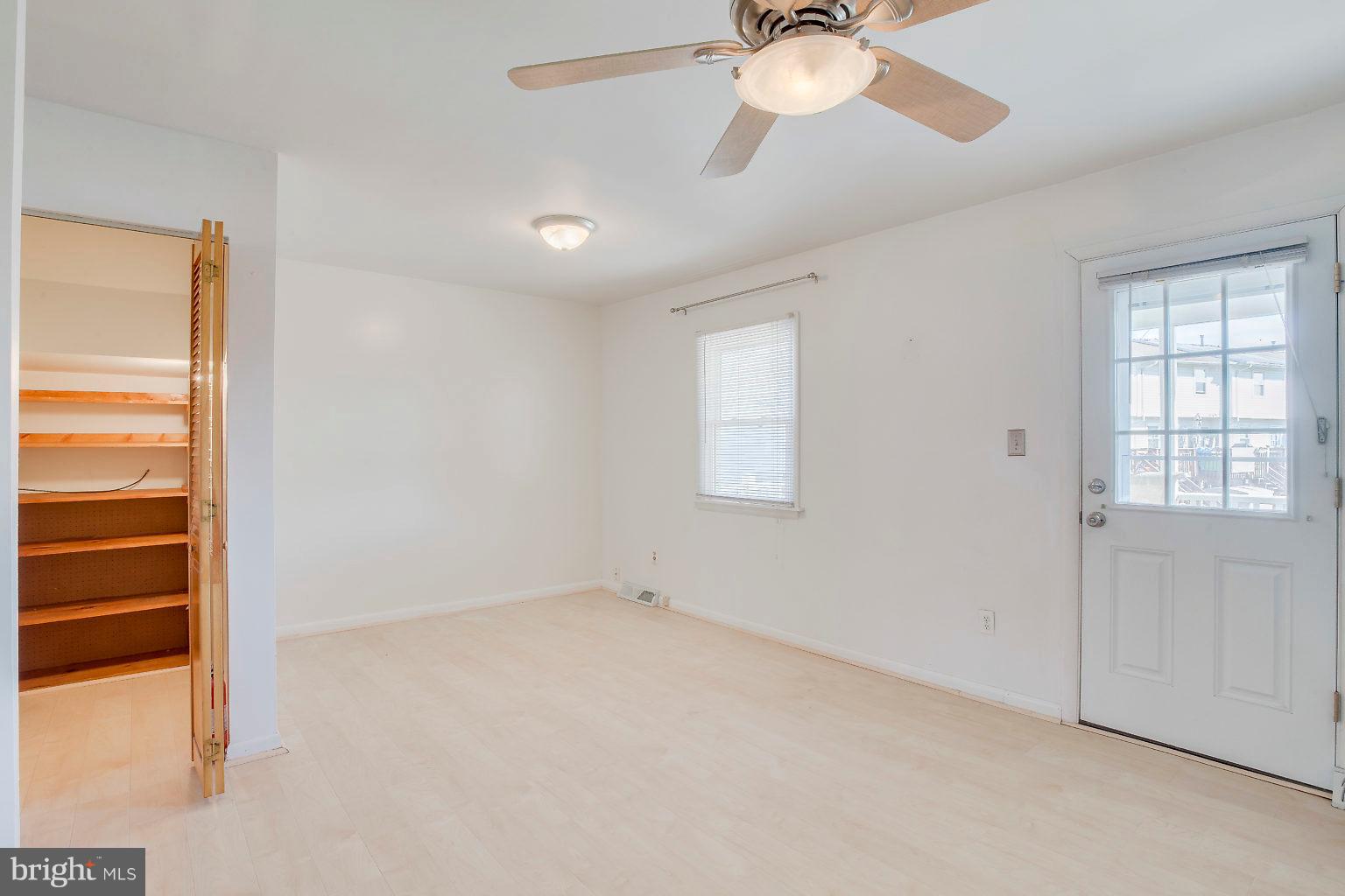 2011 Shore Road Dundalk, MD 21222 - Photo 26 of 37 an empty room with a window and a fan