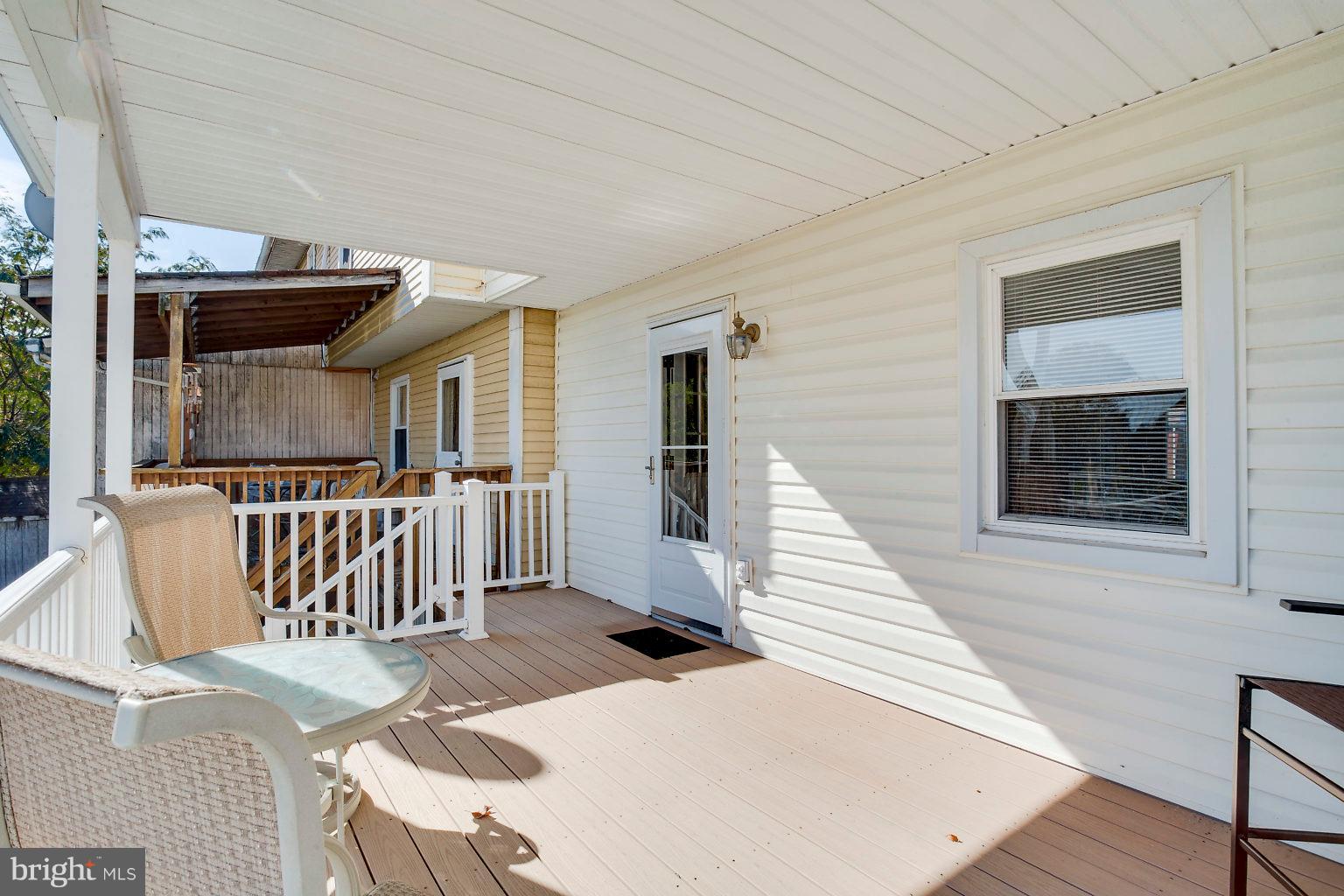 2011 Shore Road Dundalk, MD 21222 - Photo 5 of 37 a view of a patio with wooden floor and fence