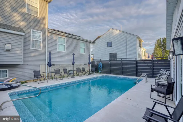 a bathroom with a toilet sink vanity and mirror
