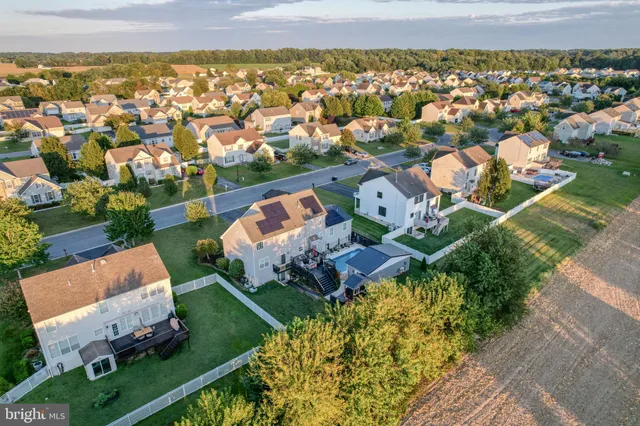 an aerial view of a house with a garden
