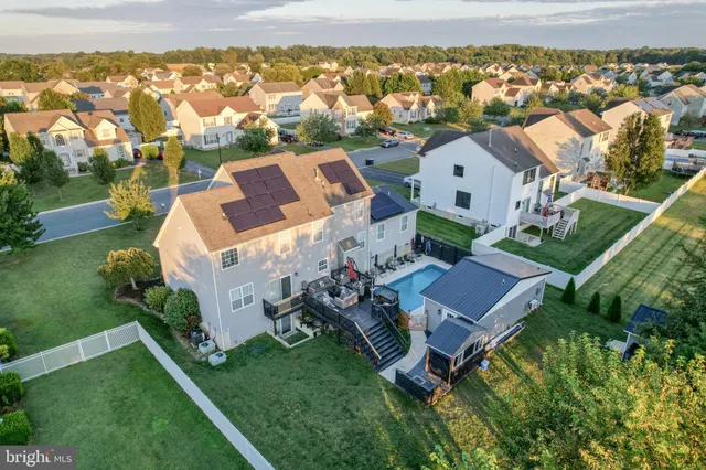 an aerial view of a house with a garden