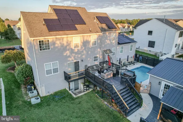 a view of house with yard entertaining space and outdoor seating