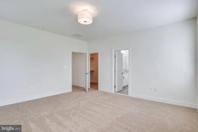 a view of an empty room and a window