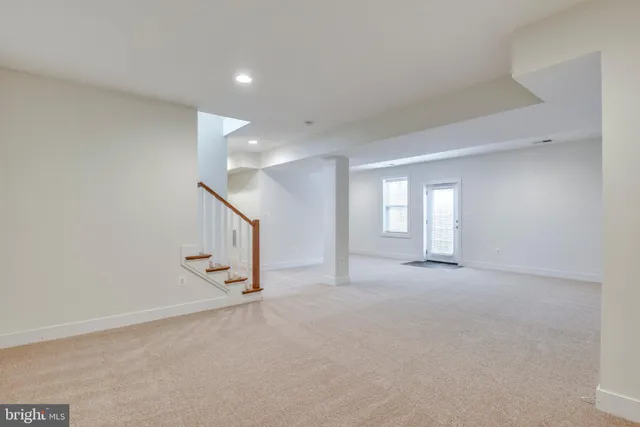 a view of an empty room with stairs