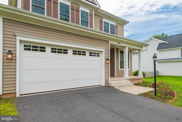 a view of a house with a street