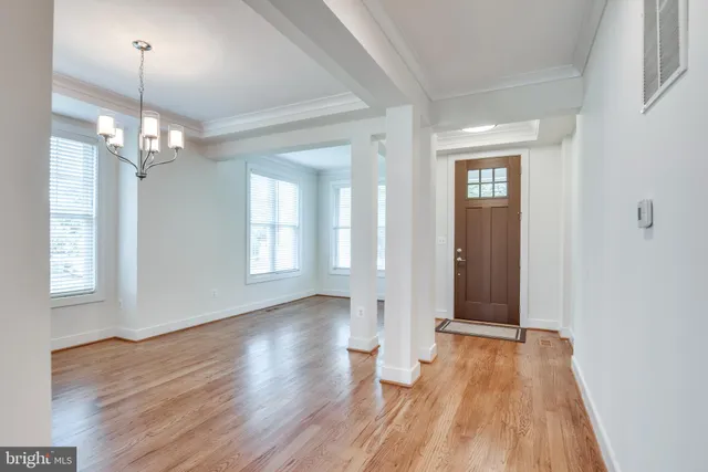 a view of livingroom with hardwood floor and kitchen view