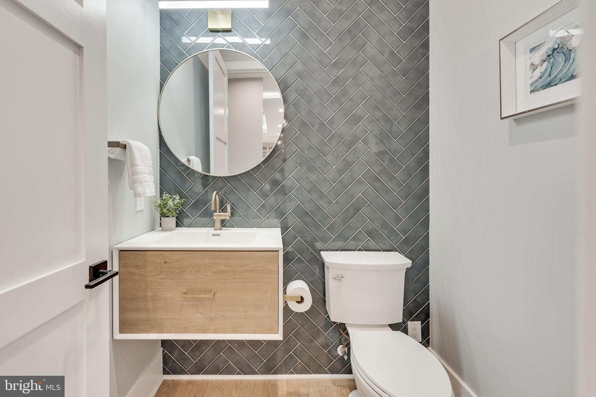 1422 Mayflower Drive McLean, VA 22101 - Photo 11 of 67 Powder Room has dramatic tile accent wall
